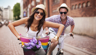 a woman with a man on the bike